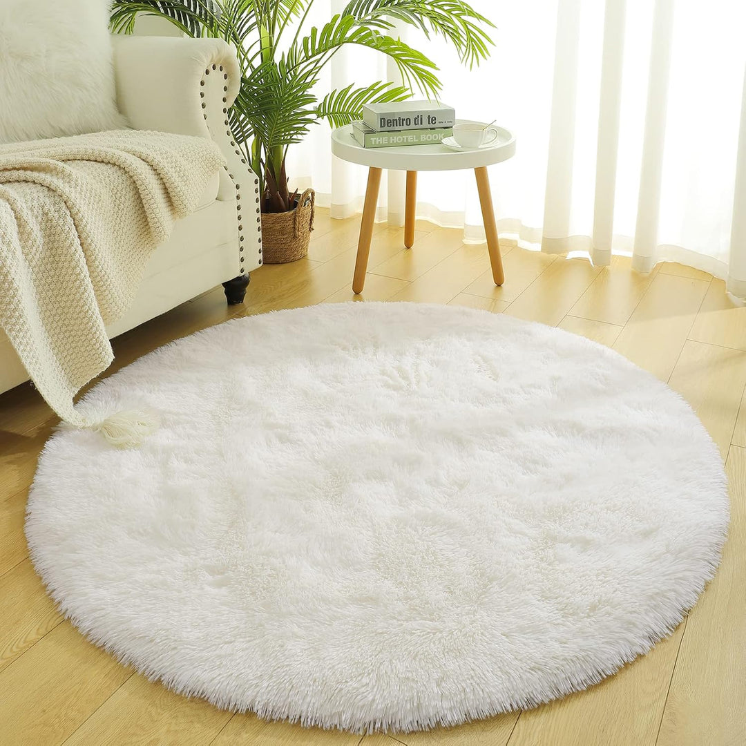 VibeCore Fluffy Round Area Rug in white placed in a living room, featuring a soft plush texture and non-slip backing. Cozy and stylish, perfect for adding comfort to any space. Easy to clean and available in 8 colors.
