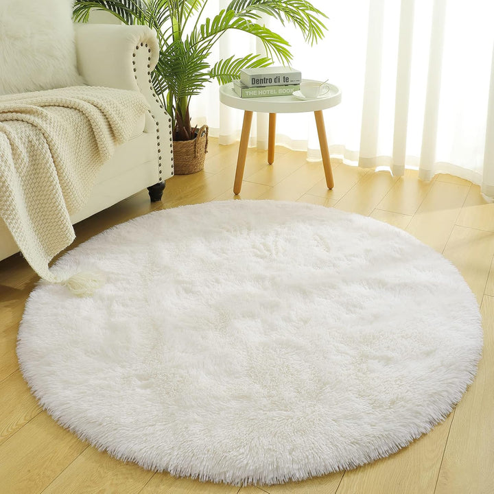 VibeCore Fluffy Round Area Rug in white placed in a living room, featuring a soft plush texture and non-slip backing. Cozy and stylish, perfect for adding comfort to any space. Easy to clean and available in 8 colors.