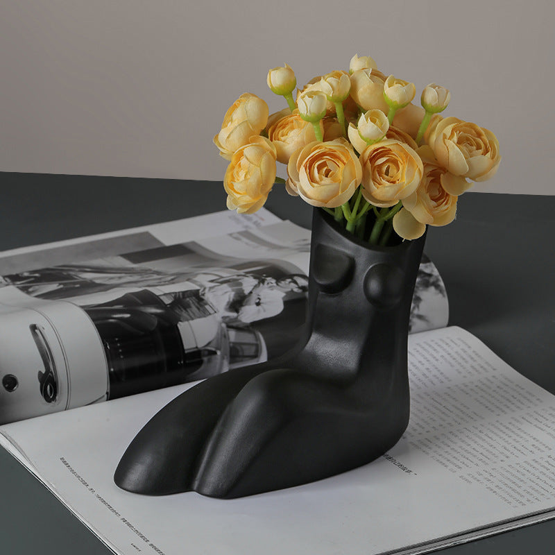 VibeCore Geometric Female Body Vase in Black, featuring a sleek and modern sculptural design that combines geometric lines and organic curves, creating a bold, minimalist statement piece.