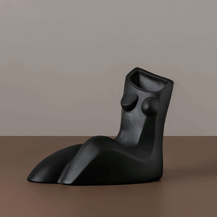 VibeCore Geometric Female Body Vase Black, showcasing a sleek, sculpted female figure with geometric lines and soft curves, made from high-quality ceramic for a bold and modern aesthetic.