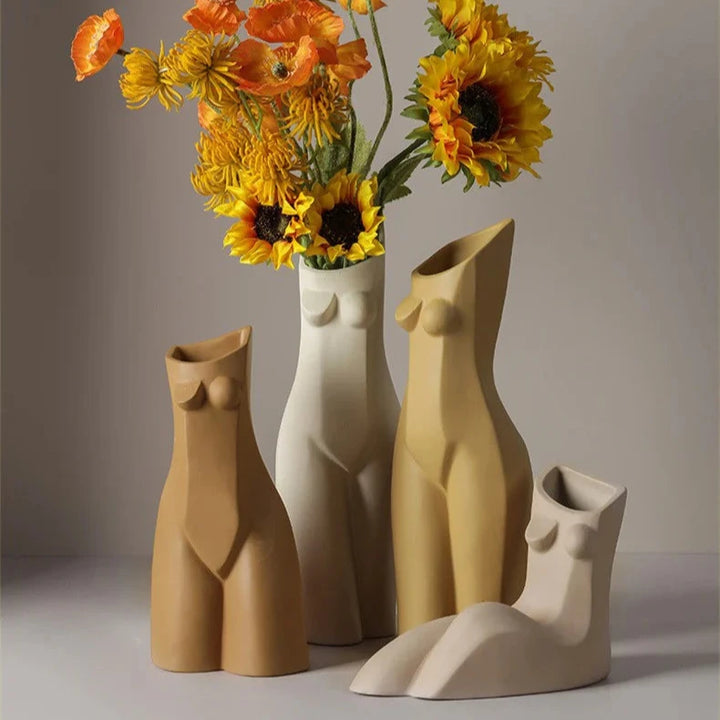 VibeCore Geometric Female Body Vase in Khaki, Brown, Beige, and White, showcasing a range of sculptural female body designs with a blend of geometric lines and organic curves in earthy, neutral tones.