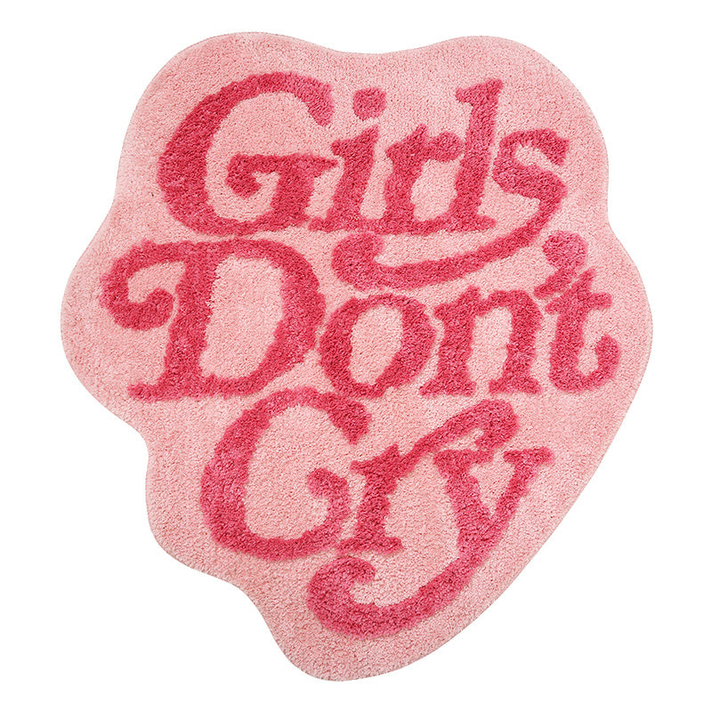Product view of the VibeCore Girls Don’t Cry Accent Rug, featuring a soft pink color with a bold, empowering message, perfect for adding personality and comfort to any room. The non-slip backing ensures stability and safety.