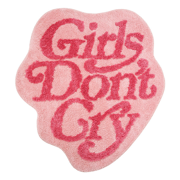 Product view of the VibeCore Girls Don’t Cry Accent Rug, featuring a soft pink color with a bold, empowering message, perfect for adding personality and comfort to any room. The non-slip backing ensures stability and safety.