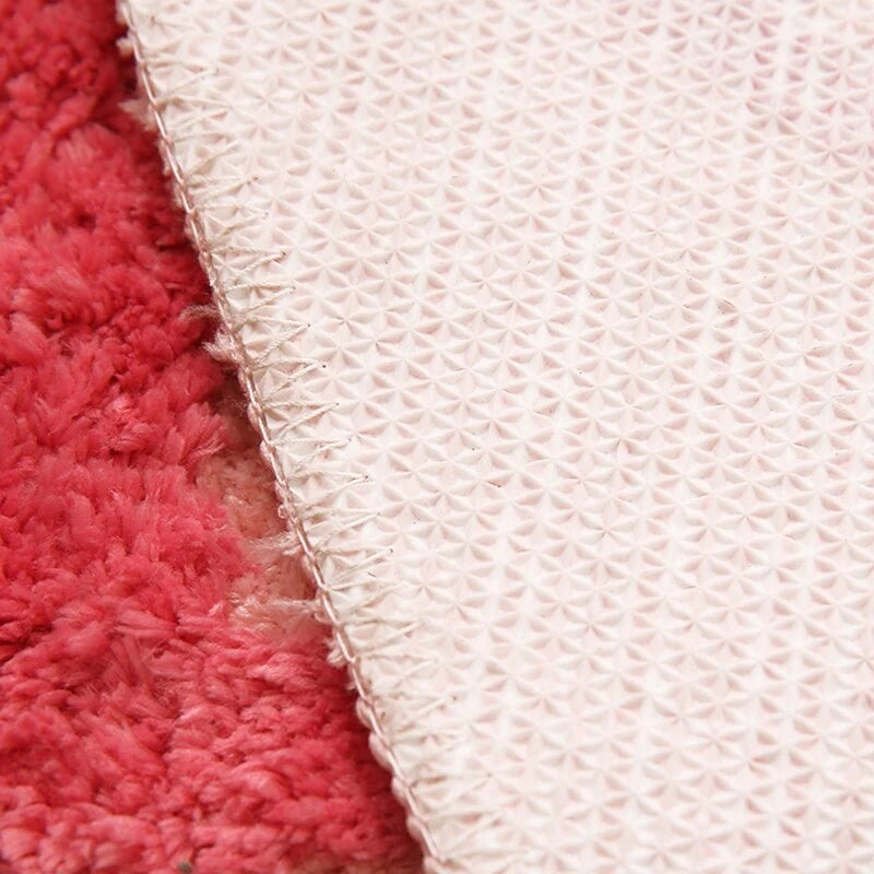 VibeCore Girls Don't Cry Accent Rug Thickness and Anti-Slip Back, demonstrating it's non-slip feature and soft material.