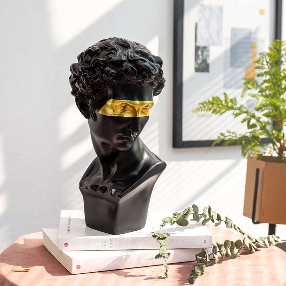 VibeCore Gold-Eye David Sculpture in black on desk, crafted from durable resin, blending classic European style with a modern gold-eye twist, perfect for adding sophistication to your workspace.