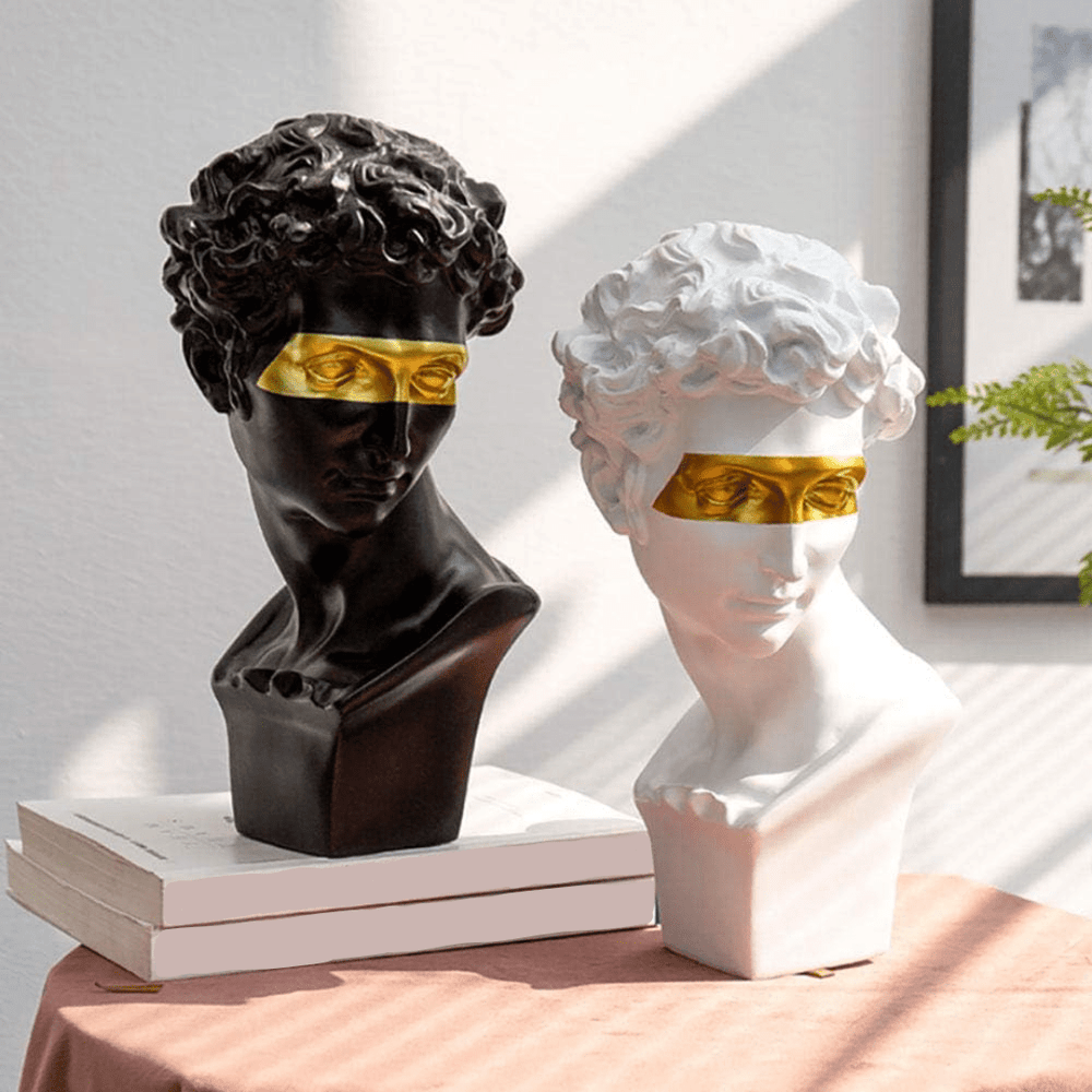 VibeCore Gold-Eye David Sculpture in black and white on table, crafted from durable resin, blending classic European style with a modern gold-eye twist, perfect for enhancing your decor.