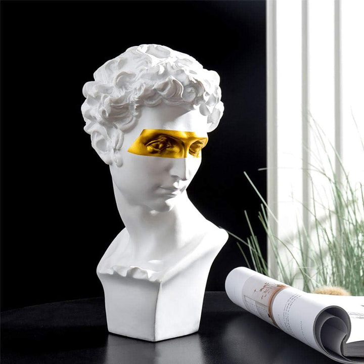 VibeCore Gold-Eye David Sculpture in white, placed in room, durable resin craftsmanship, blending classic European style with a modern gold-eye twist, perfect for adding sophistication to your decor.