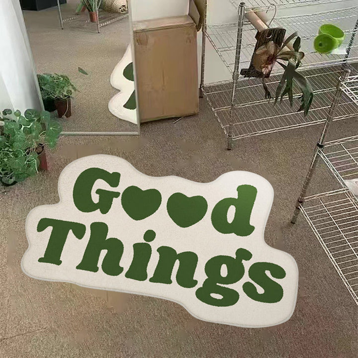 Aesthetic green "Good Things Accent Rug" displayed on the floor in an apartment, featuring a motivational Y2K message. The soft, plush texture and non-slip backing offer comfort and stability, adding a refreshing and positive touch to your living space.