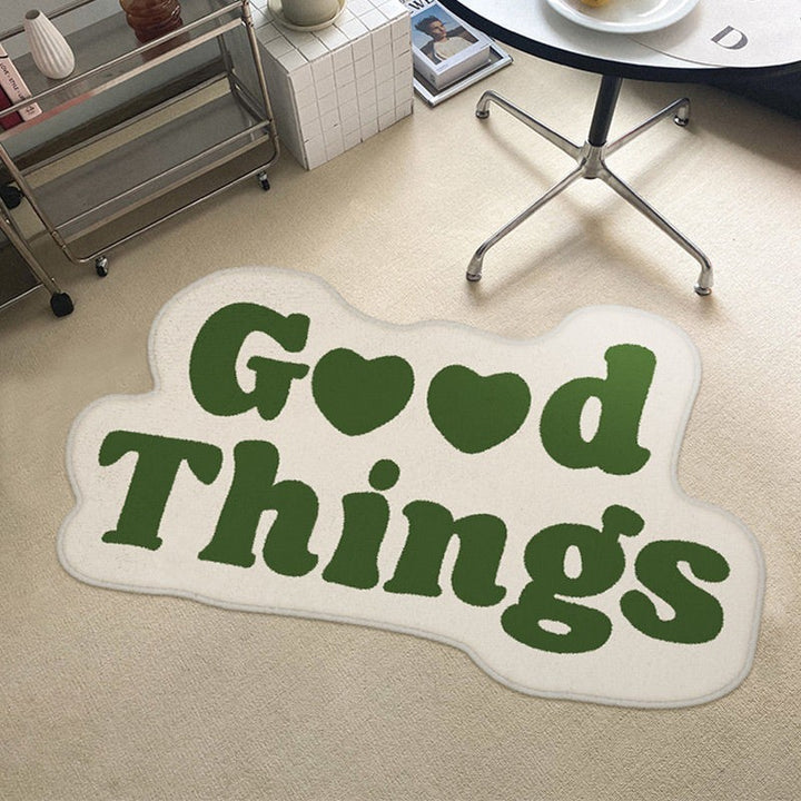Aesthetic green "Good Things Accent Rug" displayed on the floor of a room, featuring a motivational Y2K message. The soft, plush texture and non-slip backing offer comfort and stability, adding a refreshing pop of color and positivity to your space.