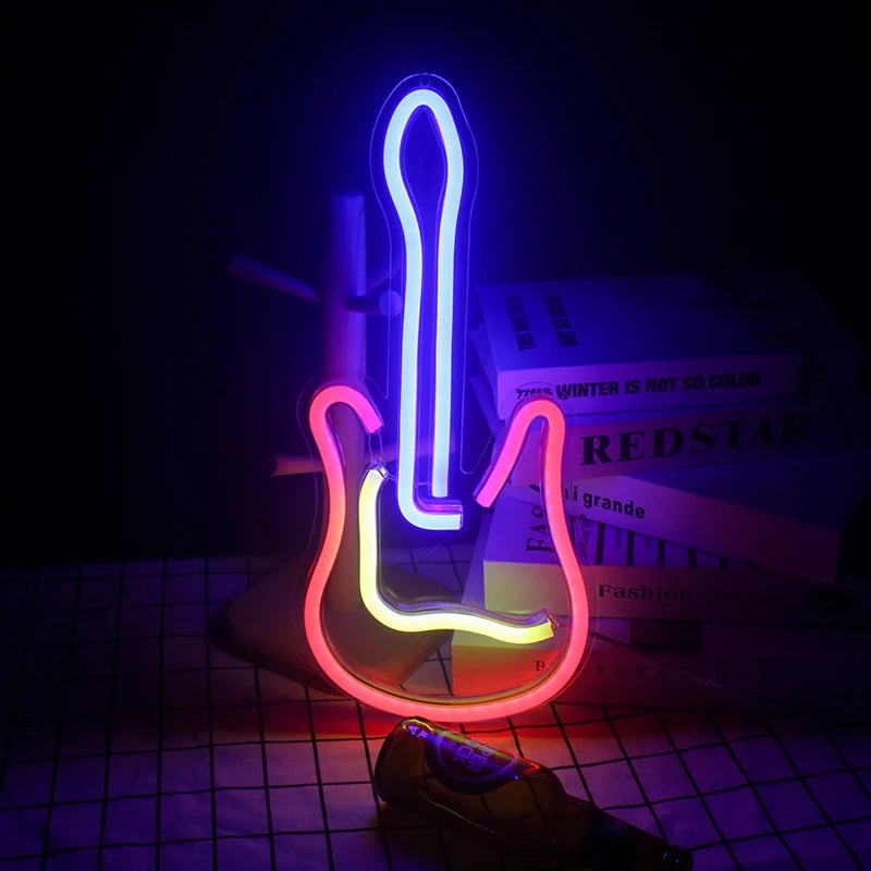 VibeCore Guitar Neon Light glowing beside books, adding a vibrant and musical ambiance to the space.