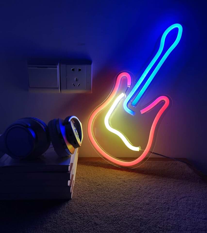 VibeCore Guitar Neon Light glowing brightly against a wall, adding a musical and vibrant touch to the room.