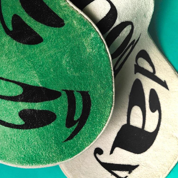 VibeCore Have A Good Day Trippy Accent Rug close-up showing both colors, green and white, with the dynamic, abstract font design. This vibrant rug features a bold text message with a groovy font shape, creating a playful and energetic vibe. The plush texture adds comfort while the striking design makes it a statement piece for your room. Perfect for those looking to add a quirky, positive touch to their space.