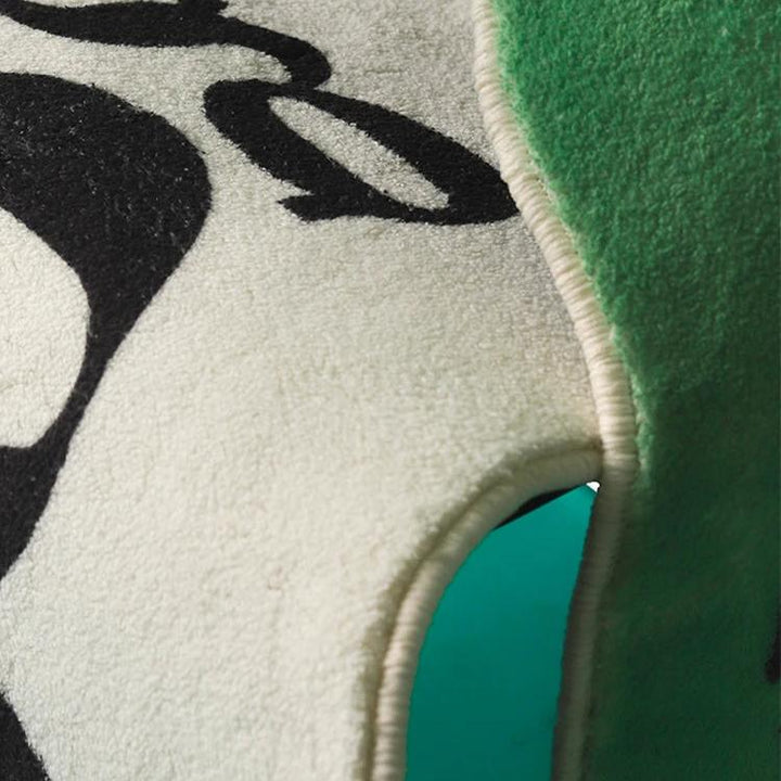VibeCore Have A Good Day Trippy Accent Rug close-up of both colors, highlighting the vibrant green and white designs. The rug features a bold, playful and dynamic text. Its plush texture adds comfort to any space while making a statement with its energetic and unique aesthetic. Perfect for adding personality and a lively vibe to your bedroom or living room decor.