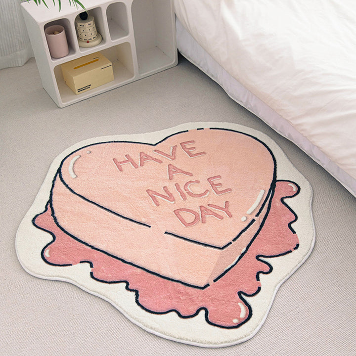 VibeCore Have A Nice Day Sweetheart Candy Accent Rug beside a bed, showcasing the rug's charming candy design and vibrant colors in a cozy bedroom setting.