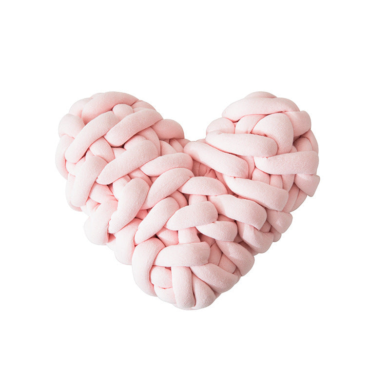 VibeCore Heart-Shaped Knot Throw Pillow in baby pink, featuring a heart-shaped, woven knot design made from soft polyester fiber. A cozy and stylish accent that adds a touch of charm and warmth to any space, perfect for creating a cozy, loving vibe.
