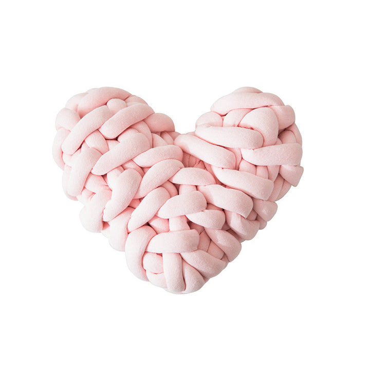 VibeCore Heart-Shaped Knot Throw Pillow in baby pink, featuring a heart-shaped, woven knot design made from soft polyester fiber. A cozy and stylish accent that adds a touch of charm and warmth to any space, perfect for creating a cozy, loving vibe.
