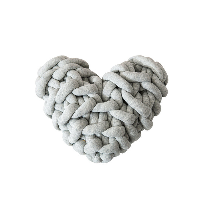 VibeCore Heart-Shaped Knot Throw Pillow in light gray, featuring a heart-shaped, woven knot design made from soft polyester fiber. A cozy and stylish accent that adds a touch of charm and warmth to any space, perfect for creating a cozy, loving vibe.