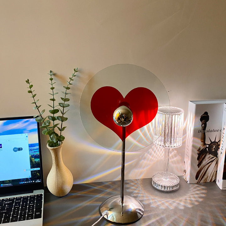VibeCore Heart Mood Lamp turned off on a table, showcasing its sleek design and compact size, ready to create a cozy ambiance when lit.
