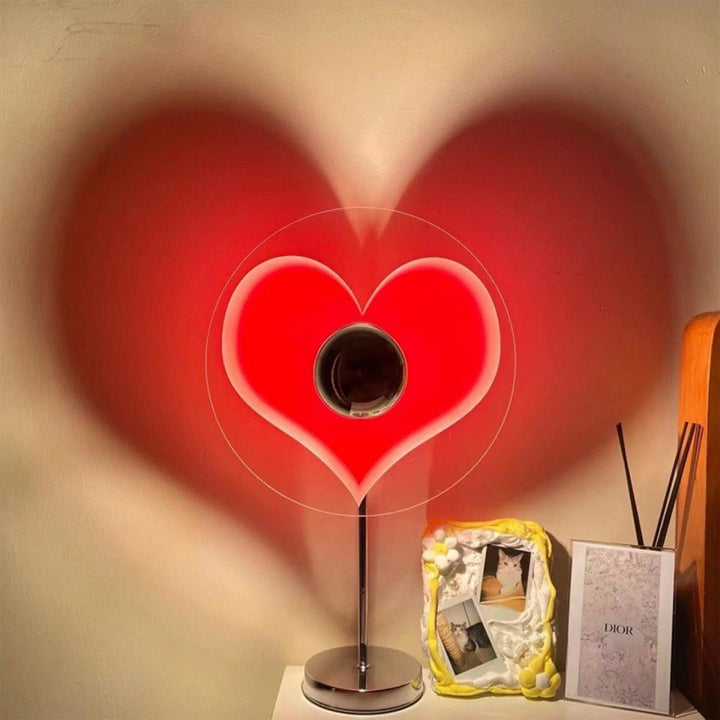 VibeCore Heart Mood Lamp projecting a heart-shaped shadow on the wall, placed on a side table, creating a cozy and romantic atmosphere.