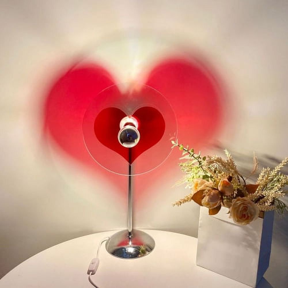 VibeCore Heart Mood Lamp casting a heart-shaped projection on the wall, placed on a table, creating a soft and cozy ambiance.