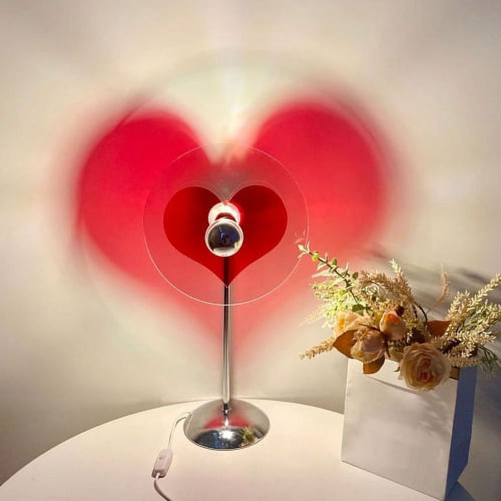 VibeCore Heart Mood Lamp casting a heart-shaped projection on the wall, placed on a table, creating a soft and cozy ambiance.