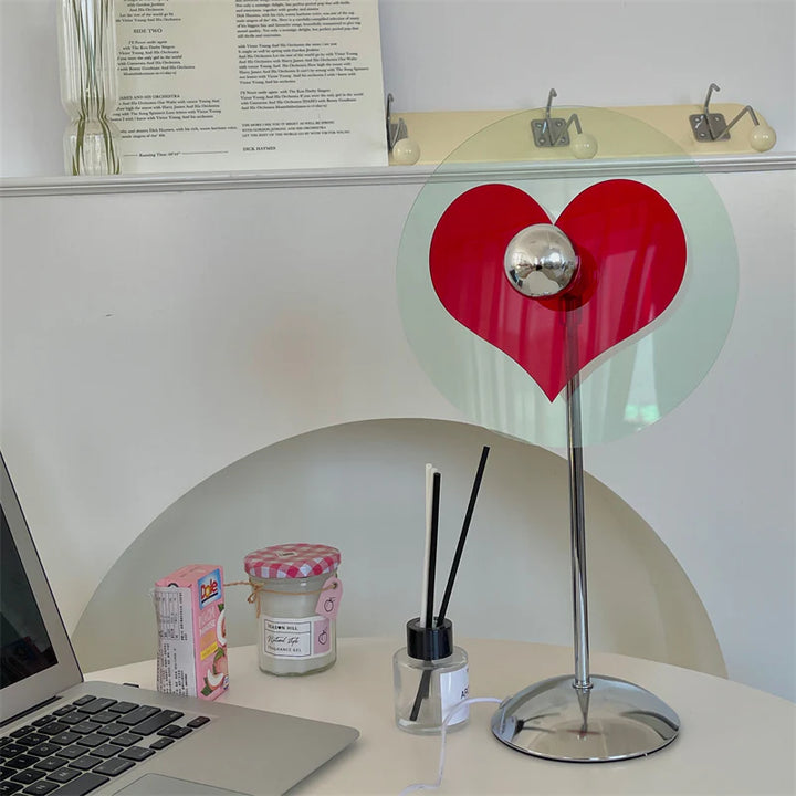 VibeCore Heart Mood Lamp unlit on a desk, showing the sleek plexiglass design and heart-shaped shadow pattern without illumination.