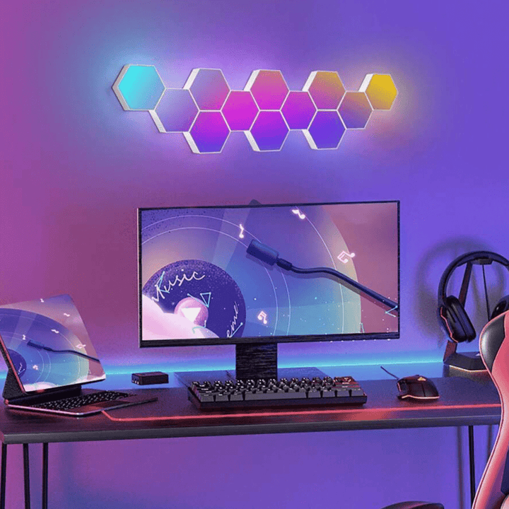 VibeCore Hexagon LED Lights above a gaming setup, casting vibrant and dynamic light across the room, enhancing the gaming atmosphere.