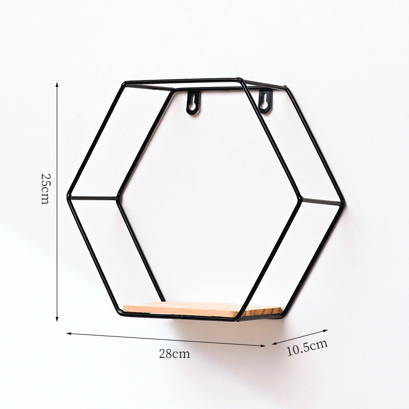 VibeCore Hexagonal Floating Wall Shelf in black, large size, mounted on a wall displaying plants, decorative items, and framed photos.