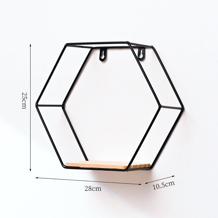 VibeCore Hexagonal Floating Wall Shelf in black, large size, mounted on a wall displaying plants, decorative items, and framed photos.