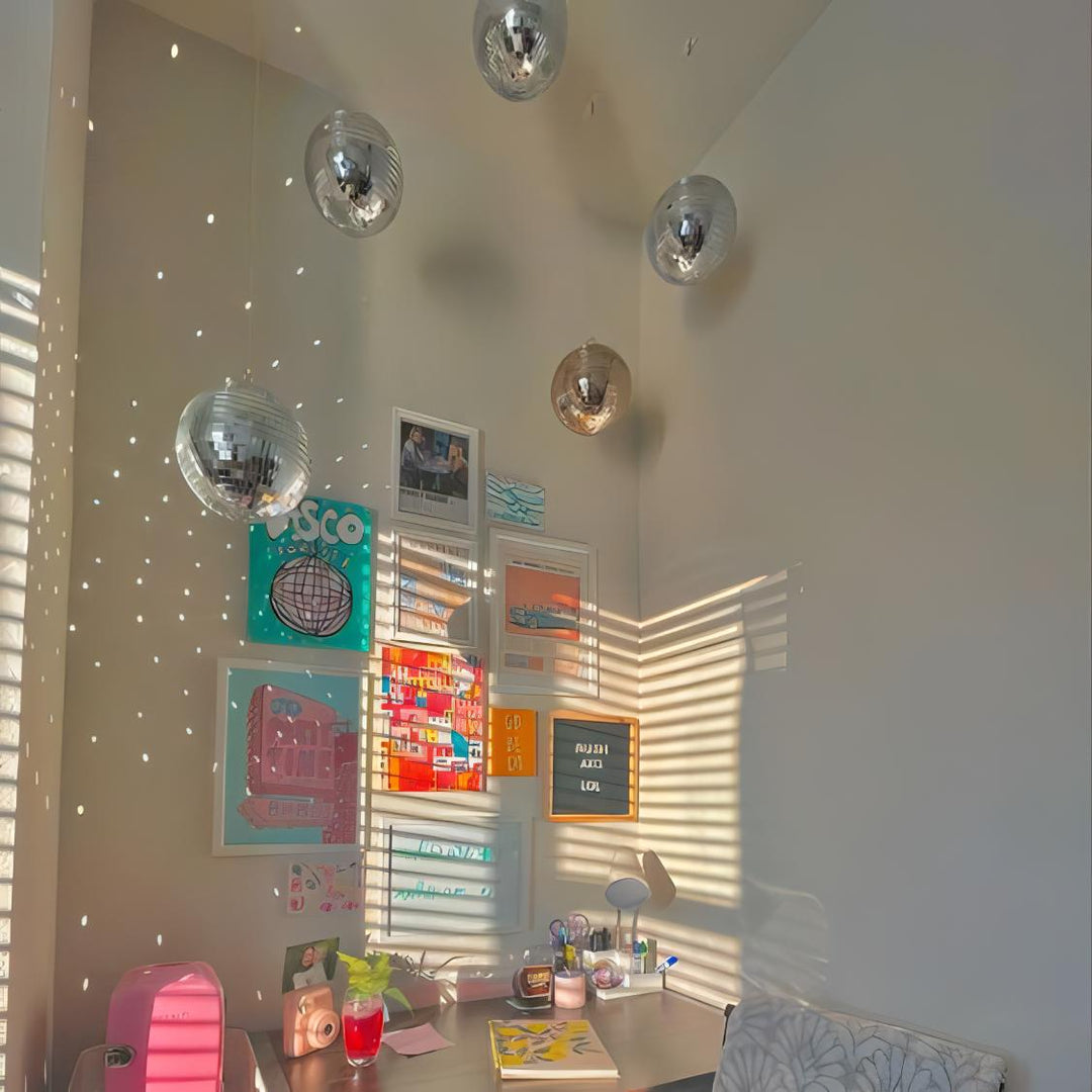 VibeCore Iconic Disco Balls—several small ones hanging together, creating a dazzling, multi-reflective light show that fills the space with playful energy and a festive vibe.