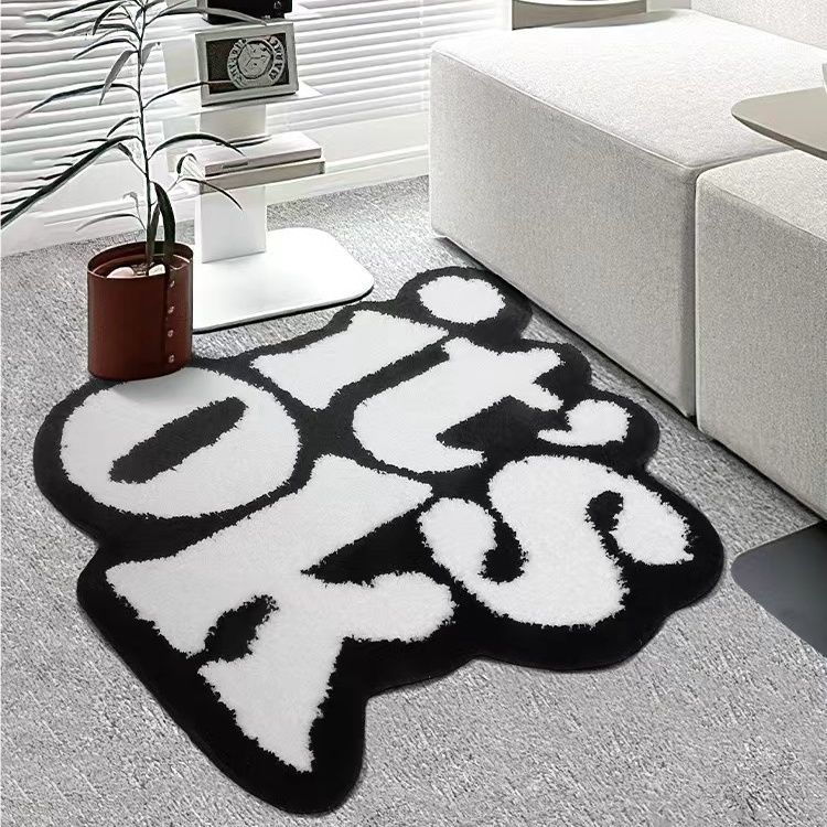 VibeCore It's Ok Accent Rug Side View: This minimalist rug showcases the iconic black and white 'It's Ok' quote in a simple yet stylish design. Perfect for a calming ambiance, it fits seamlessly into any bedroom, dorm, or living room. The side view highlights its sleek edges and plush texture, adding both comfort and positive vibes to your space.