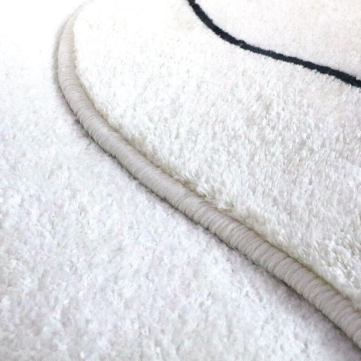VibeCore Ivory Abstract Oval Area Rug close-up, showcasing the fine texture and soft polyester fibre that creates a plush, luxurious feel for any space.