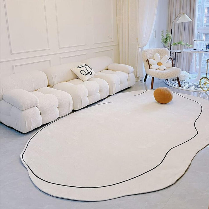 VibeCore Ivory Abstract Oval Area Rug in luxurious living room, featuring a soft neutral tone and refined oval shape that complements sophisticated interior designs.