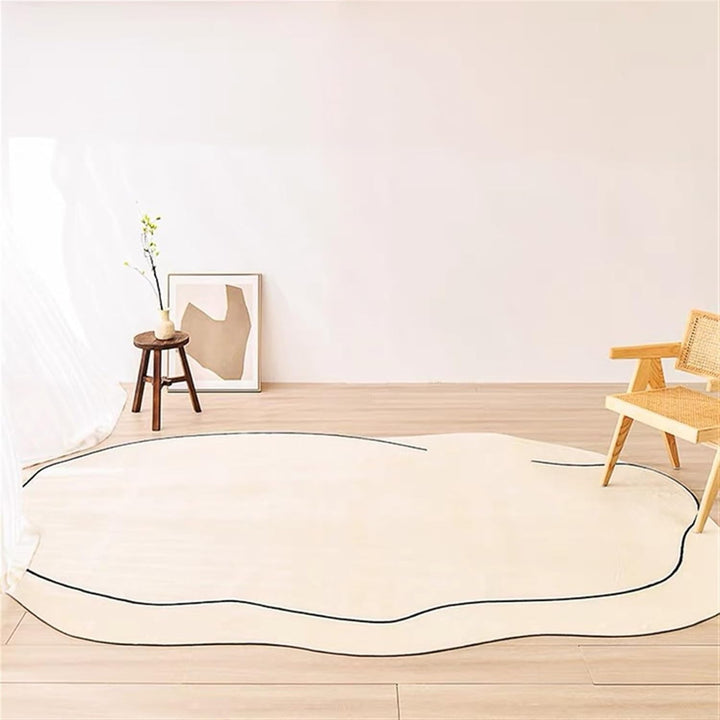 VibeCore Ivory Abstract Oval Area Rug on floor, showcasing its smooth oval shape and neutral tone that enhances the elegance and comfort of any space.
