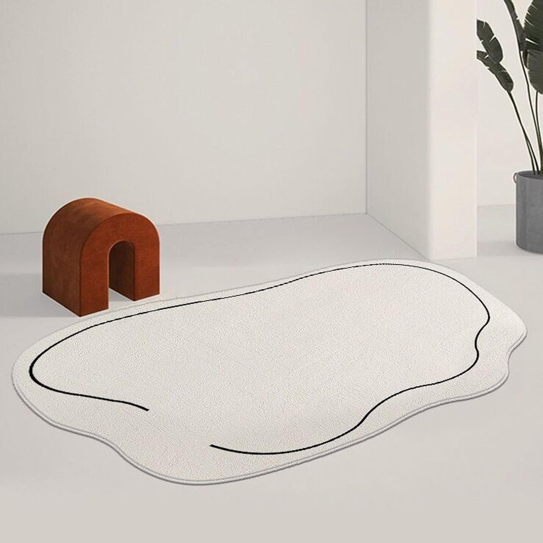 VibeCore Ivory Abstract Oval Area Rug on white floor, adding a sophisticated touch with its neutral tone and smooth oval shape, perfect for enhancing any room's decor.