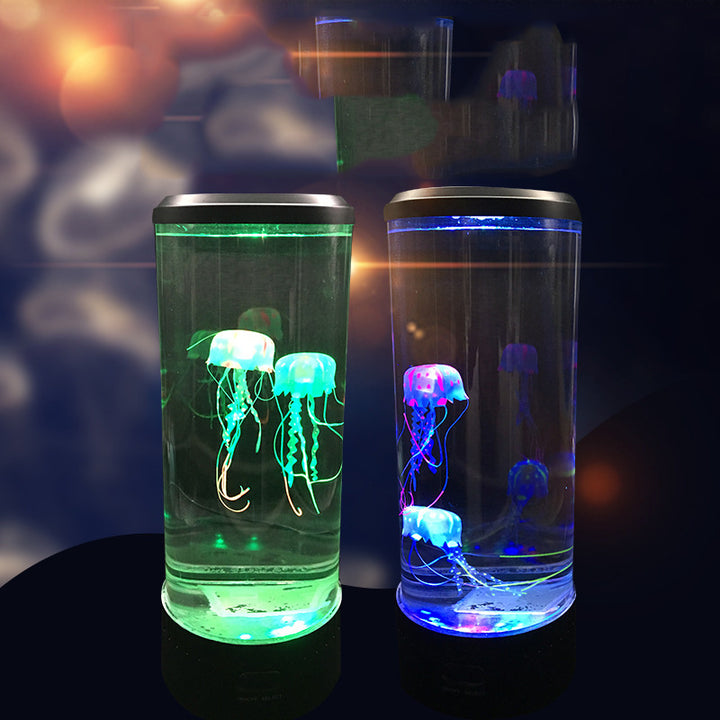 VibeCore Jellyfish Lava Lamps side by side, each featuring two lifelike jellyfish floating in a soothing, color-changing glow. The calming LED lights offer customizable colors, including Blue, Green, Purple, Red, and Orange, to create the perfect ambiance. These USB or battery-powered lamps come with remote controls for easy adjustments and energy-saving automatic shut-off after 4 hours.