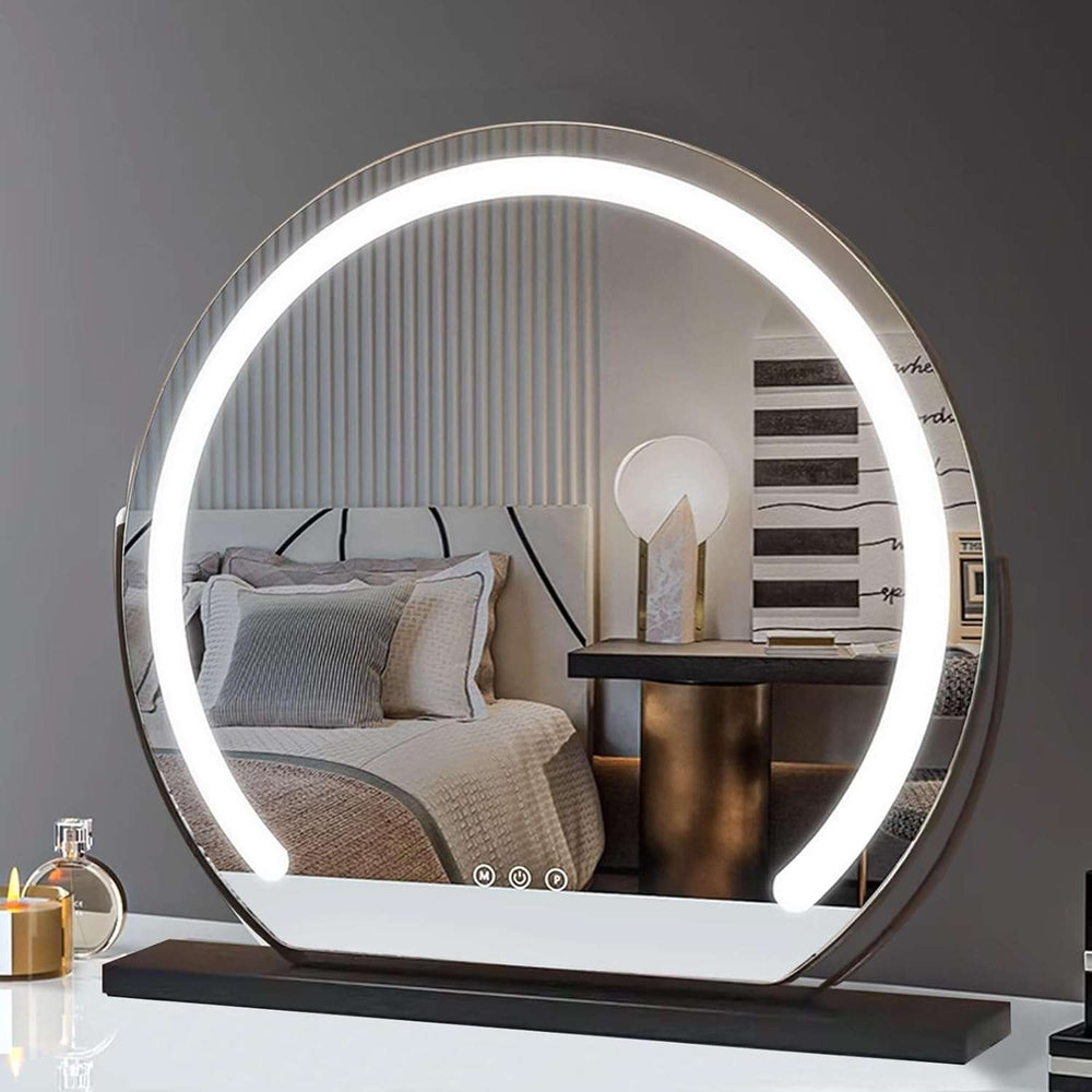 VibeCore LED Light-Up Vanity Mirror on a dresser, angled to show its sleek metal frame, built-in LED light strip, and 360° rotating design.