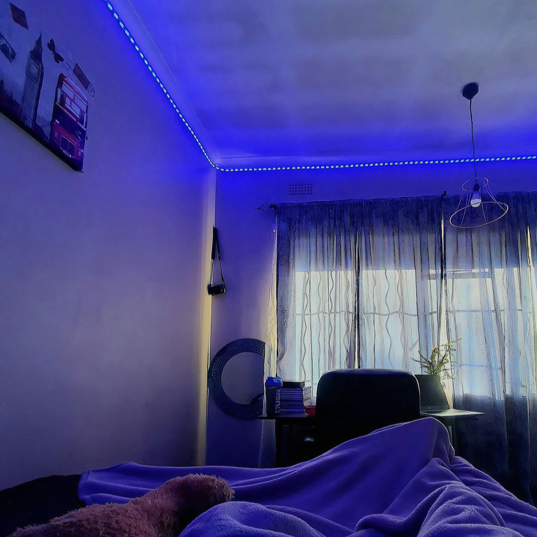 VibeCore LED Strip Lights in blue illuminating a bedroom, creating a cool and calming ambiance.