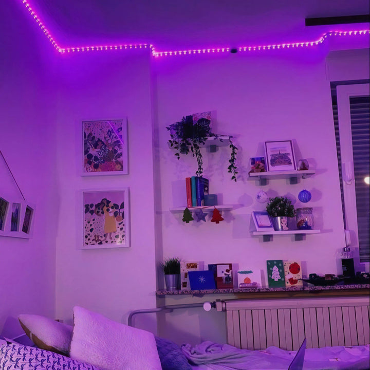 VibeCore LED Strip Lights in purple illuminating a bedroom, adding a vibrant and cozy atmosphere.