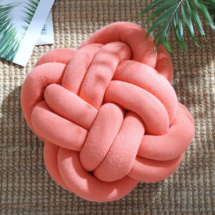 VibeCore Large Handmade Knot Throw Pillow in Coral Pink, showcasing its chunky, handmade knot design and ultra-soft texture, adding a bold, cozy touch to any room.