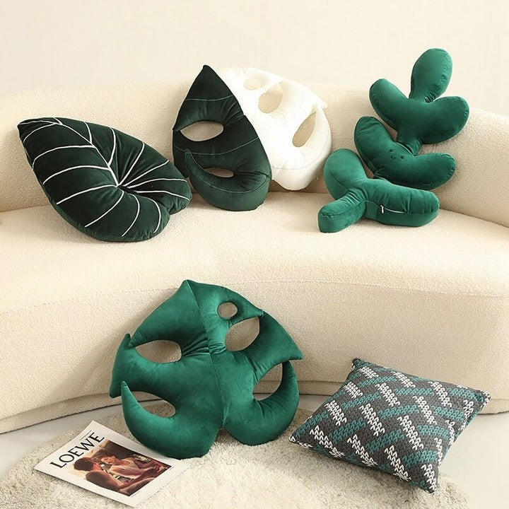 VibeCore Leaf Throw Pillows in all options—Monstera Deliciosa, Philodendron, and White Fancy Carp—styled on a couch. Soft velvet plush pillows with nature-inspired designs, adding a fresh, cozy vibe to your living space.