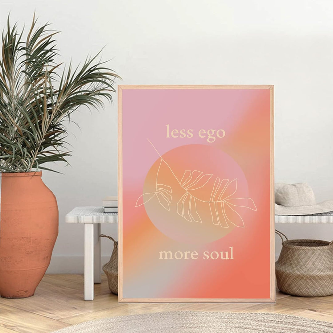 VibeCore Less Ego More Soul canvas print framed against a bench, inspirational minimalist typography art for bedroom, dorm, or spiritual apartment decor.