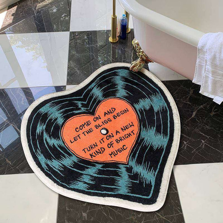 VibeCore "Let The Bliss Begin Accent Rug" in bathroom, featuring a cartoon heart design, adding a modern, cozy touch to the space.