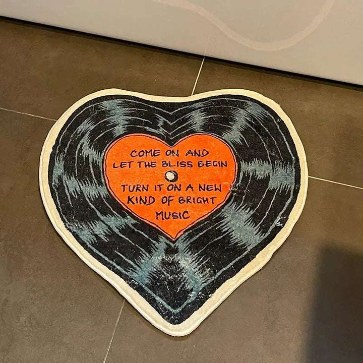 VibeCore "Let The Bliss Begin Accent Rug" in front of the tub, featuring a playful cartoon heart design, adding warmth and urban charm to the bathroom space.