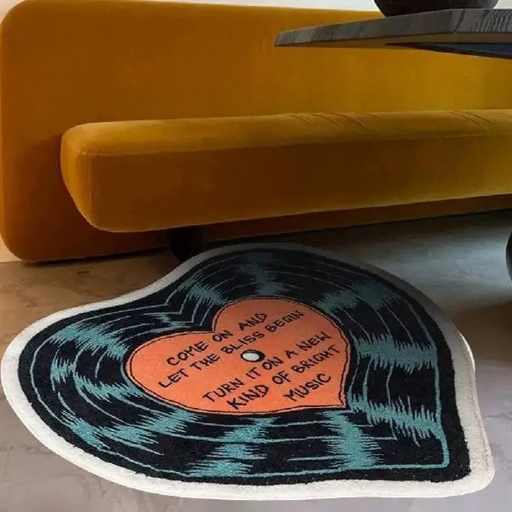 VibeCore "Let The Bliss Begin Accent Rug" in the living room, featuring a cartoon heart design, adding a cozy and modern touch to the space.