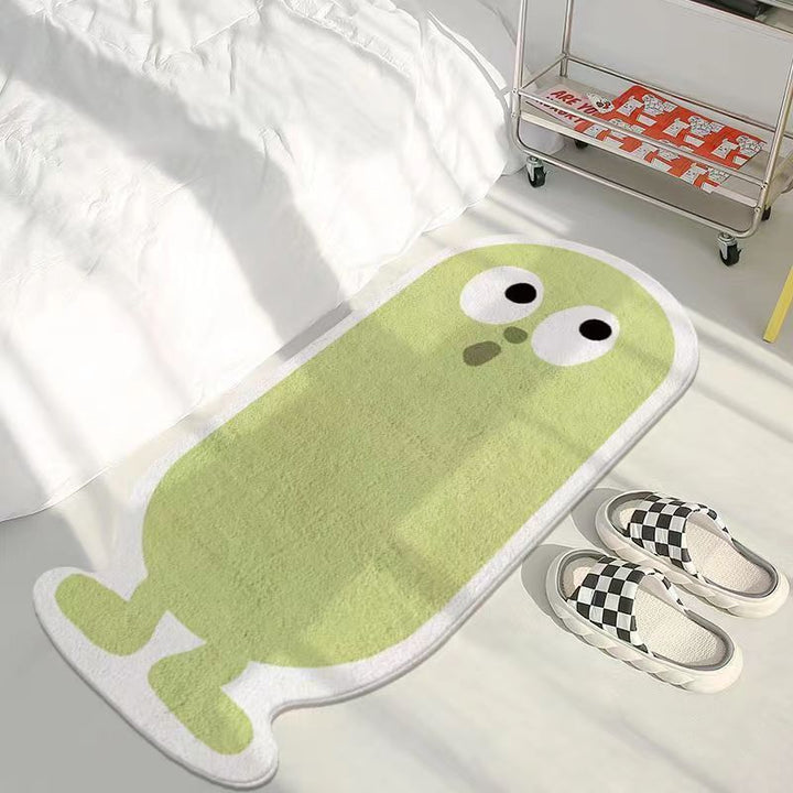 VibeCore Lil Blob Guy Accent Rug in green featuring a playful blob character with a cute smile. This fun, quirky rug brings a unique touch to any room while providing a plush, soft texture and a non-slip backing for safety. Ideal for bedrooms, dorms, or any space that needs a burst of color and personality.