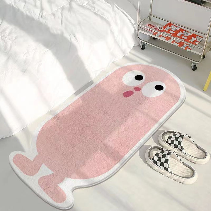 VibeCore Lil Blob Guy Accent Rug in pink, featuring a playful and quirky design. The rug’s plush texture adds comfort while its non-slip backing ensures safety. Ideal for bringing personality and warmth to living rooms, bedrooms, or dorms.