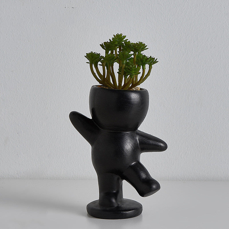 VibeCore Lil Buddy Planter in black, unique humanoid design, Nordic-inspired style, crafted from premium clay, ideal for adding personality and charm to your plant collection.