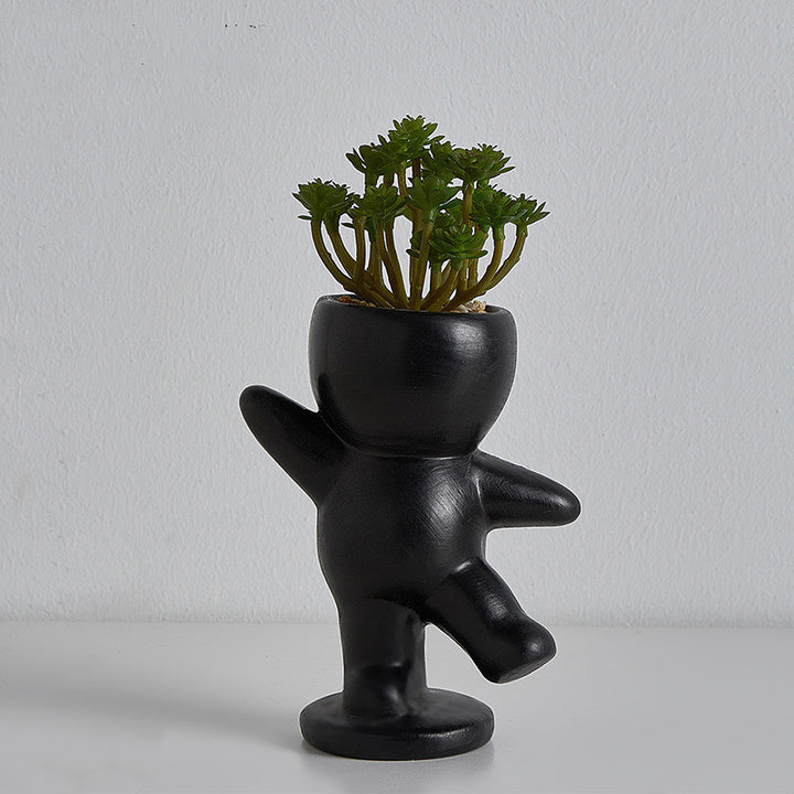VibeCore Lil Buddy Planter in black, unique humanoid design, Nordic-inspired style, crafted from premium clay, ideal for adding personality and charm to your plant collection.
