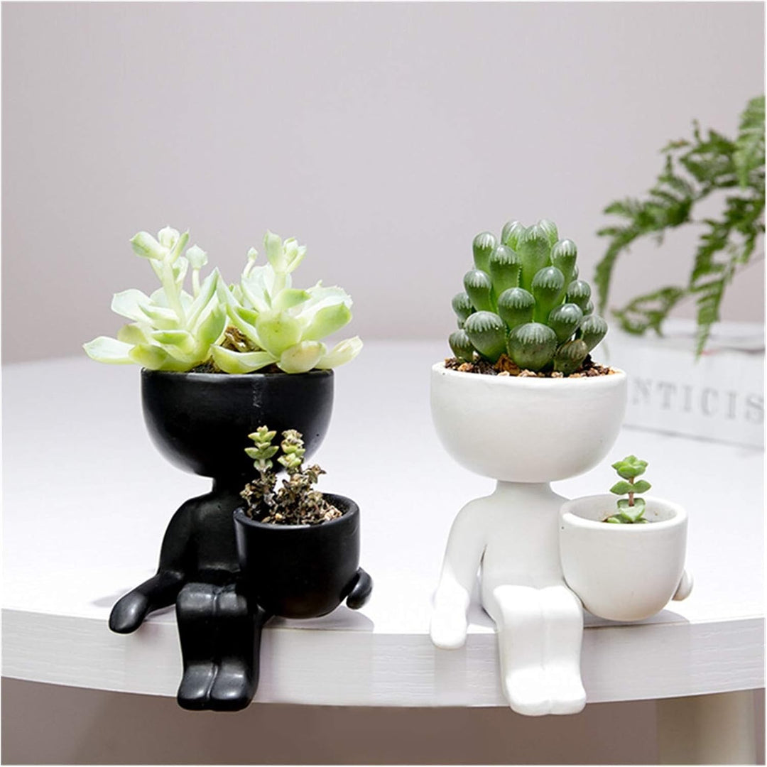 VibeCore Lil Buddy Planter in black and white (Option A and B), quirky humanoid design, Nordic-inspired style, crafted from premium clay, perfect for adding personality and charm to your plant display.
